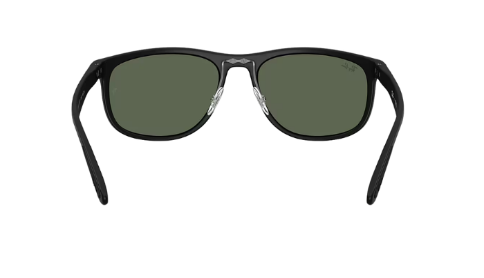 Black Ray-Ban RB4468 sunglasses with green lenses on a white background