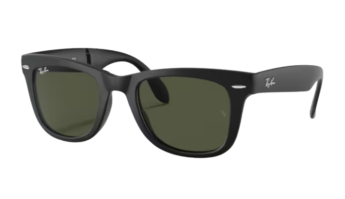 Black sunglasses with green lenses on a white background