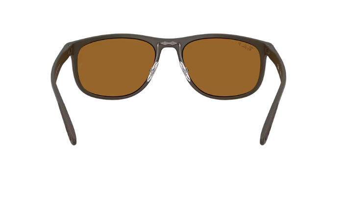 Ray-Ban Sunglasses with brown lenses and dark frame on a white background