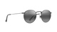Round sunglasses with dark lenses on a white background