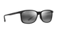 Black sunglasses with reflective lenses on a white background