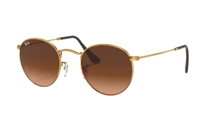 Ray-Ban Round sunglasses with gold frame and brown lenses on a white background