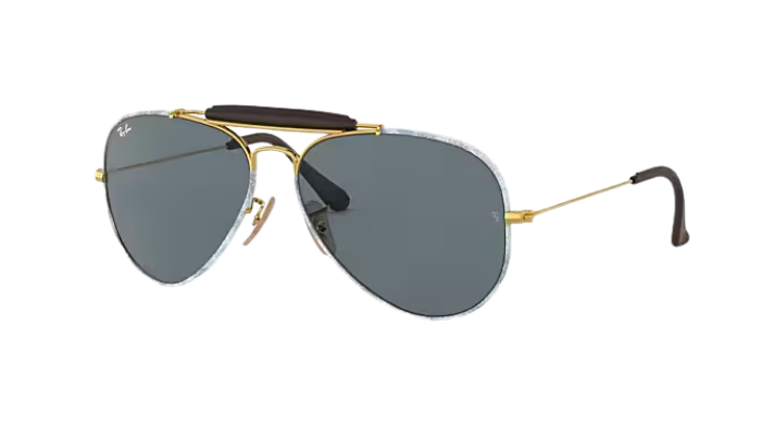 Aviator Ray-Ban sunglasses with denim gold frame and dark lenses on a white background