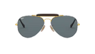 Aviator Ray-Ban sunglasses with denim gold frame and dark lenses on a white background