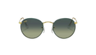 Round sunglasses with gold frame and gradient green lenses on a white background