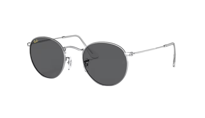 Round sunglasses with dark lenses and thin metal frame on a white background