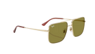 Gold-framed sunglasses with green lenses on a white background