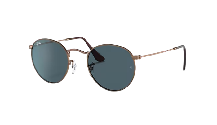 Ray-Ban Round sunglasses with gold frame and dark lenses on a white background