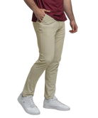 Person wearing beige pants and white sneakers on a white background