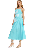 Woman wearing a light blue dress with floral patterns on a white background