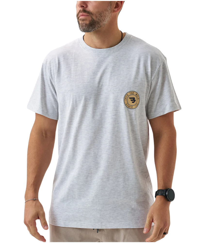 Man wearing a gray t-shirt with a logo on a white background