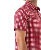 Man wearing red and white polo with Alabama state outline print. Perfect for Game Day.