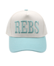 Cap with 'REBS' text on a white background