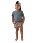 Child wearing a gray t-shirt and camo patterned swim shorts on a white background