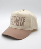Beige and brown cap with 'Tailgate Captain' text on a light gray background