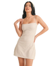 Woman wearing a beige checkered dress on a white background