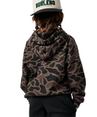 A child shown from the back wearing a brown and black camouflage hoodie, black pants, and a white cap with green and black text that reads 'BURLEBO OUTDOORS'.