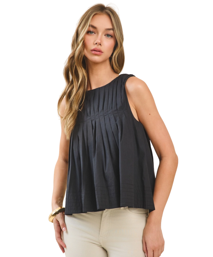 Woman wearing a black sleeveless top on a white background