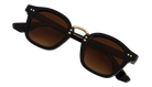 Black Krewe sunglasses with gold accents on a white background