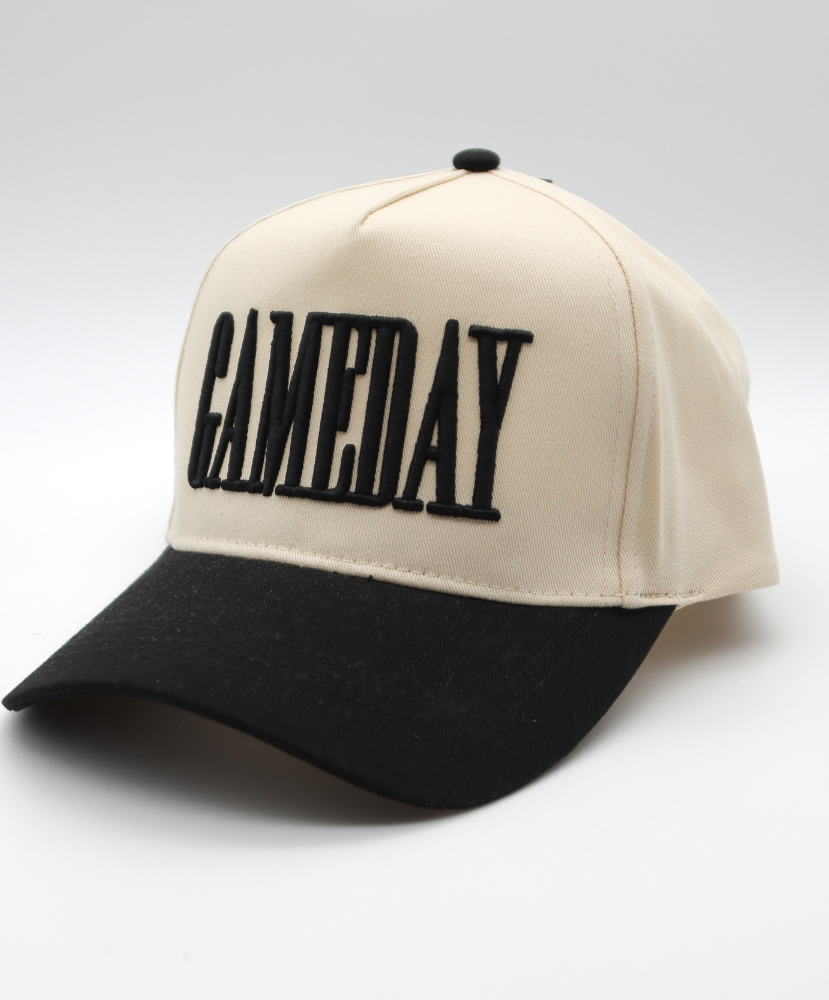 Beige and black cap with 'GAMEDAY' text on a light gray background