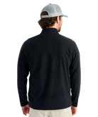 Man wearing a black long-sleeve shirt and a gray cap on a white background