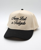 Beige and black cap with 'Never Last a Tailgate' text on a white background