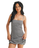 Woman wearing a black and white gingham dress on a white background