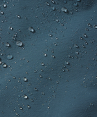 Close-up of water droplets on shorts blue surface