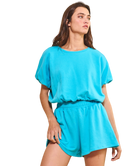 Woman wearing a blue outfit on a white background