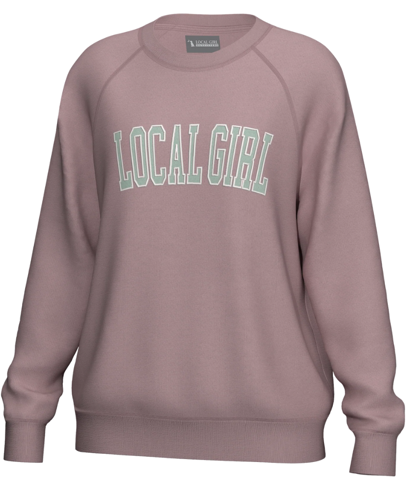 Pink sweatshirt with 'LOCAL GIRL' text on a white background