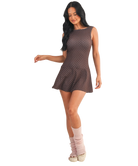 Woman wearing a brown polka dot dress on a white background