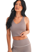 Woman wearing a brown and white GINGHAM checkered tank on a white background