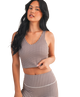 Woman wearing a brown and white GINGHAM checkered tank on a white background