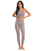 Woman wearing a brown and white GINGHAM checkered tank on a white background