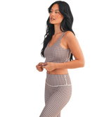 Woman wearing a brown and white GINGHAM checkered tank on a white background