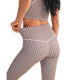 Person wearing a brown and white checkered outfit on a white background