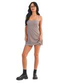 Woman wearing a checkered dress on a white background