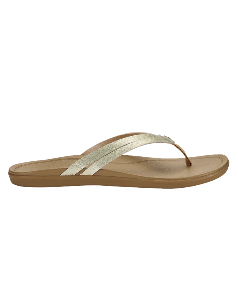 Beige OLUKAI sandal with a strap on a white background