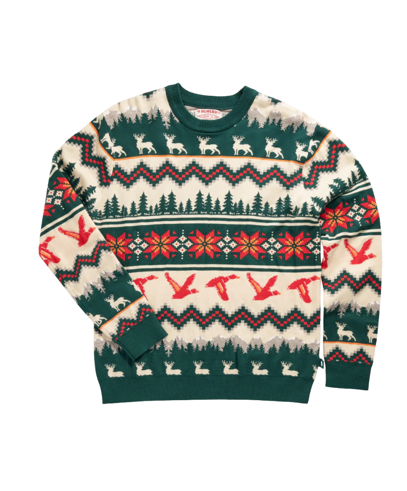 Christmas-themed sweater with reindeer, trees, and snowflakes on a white background