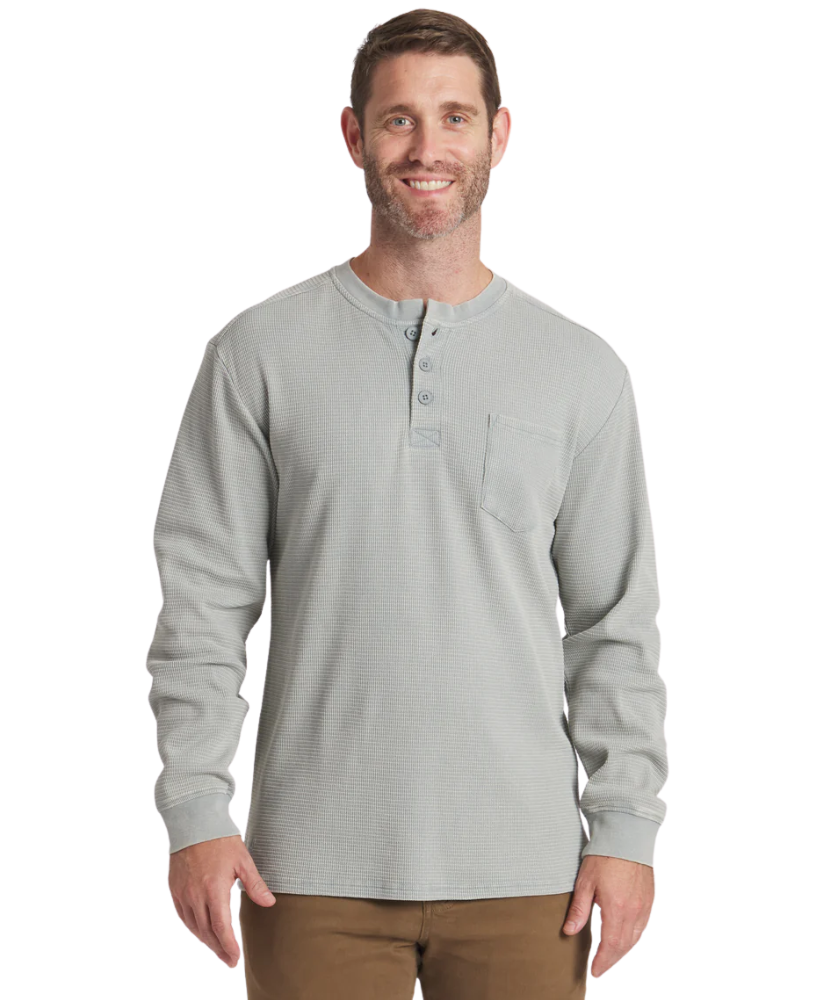 Man wearing a burnt sage long-sleeve henley shirt on a white background