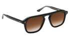 Black Krewe sunglasses with brown gradient lenses on a white background