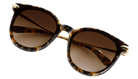 Krewe Sunglasses with tortoiseshell frame and brown lenses on a white background