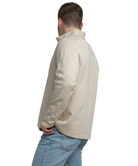 Man wearing a beige fleece jacket on a white background