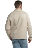 Tan quarter zip pullover with a plaid shirt underneath on a white background