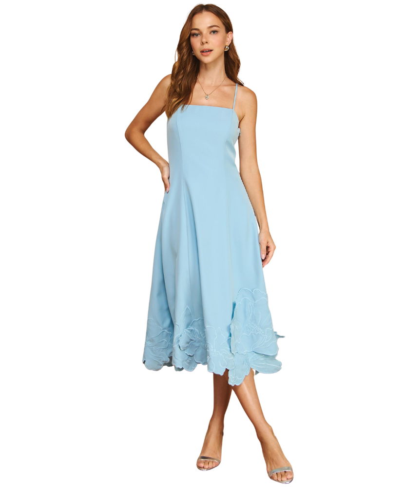 Woman wearing a light blue dress on a white background