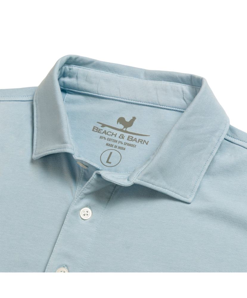 Light blue Beach & Barn polo shirt with a pocket on a white background
