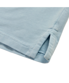 Light blue Beach & Barn polo shirt with a pocket on a white background