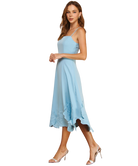 Woman wearing a light blue dress on a white background