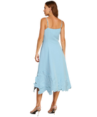 Light blue dress with ruffled hem on a white background