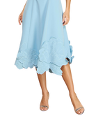 Light blue dress with floral details on a white background